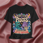 Black t-shirt with colorful Pisces zodiac design on a pink fabric background