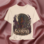 Cream T-shirt with Scorpio zodiac design on a textured red background