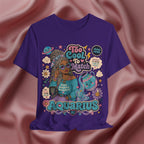 Purple t-shirt with Aquarius-themed design featuring a person with braided hair 