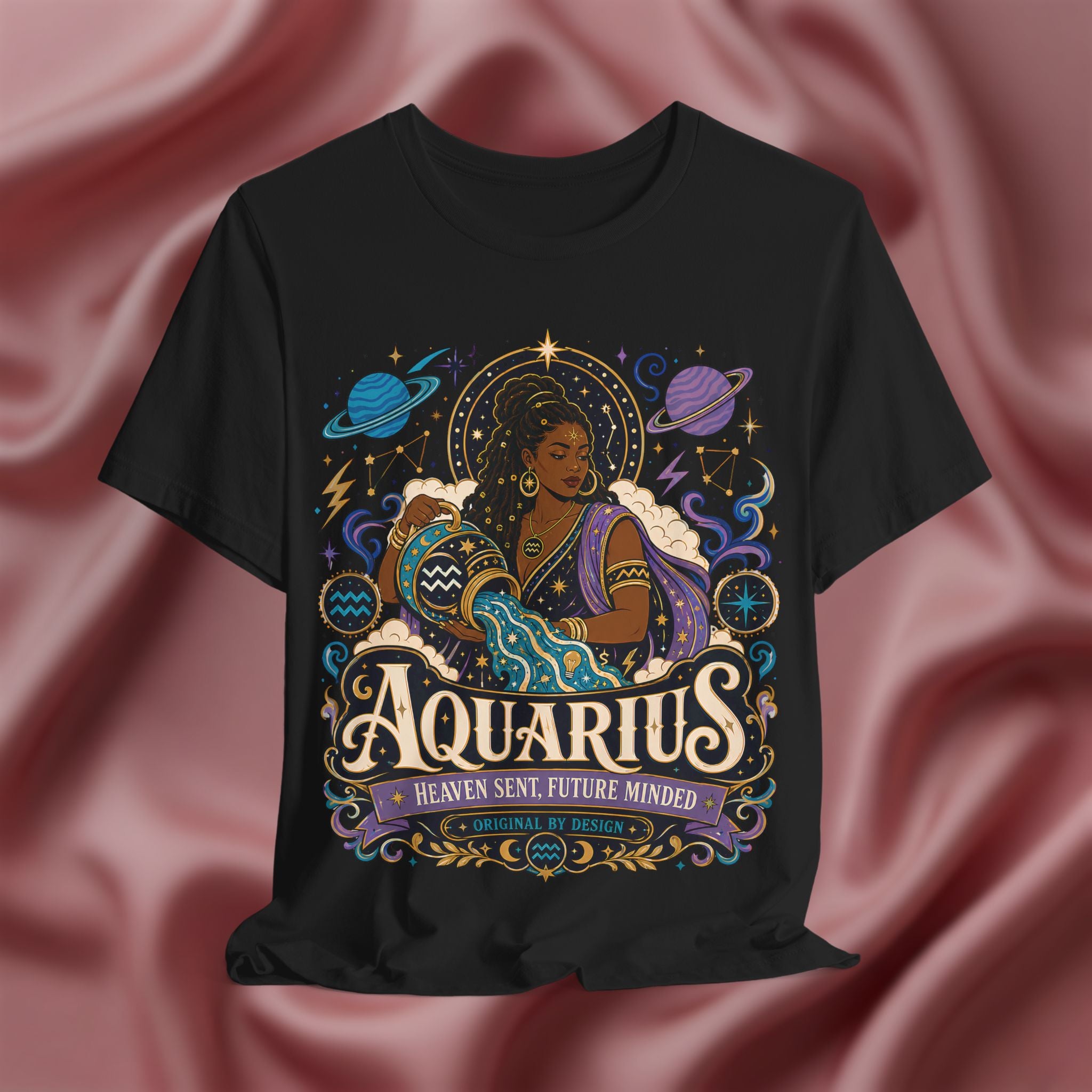 Black t-shirt with Aquarius zodiac design on a pink fabric background