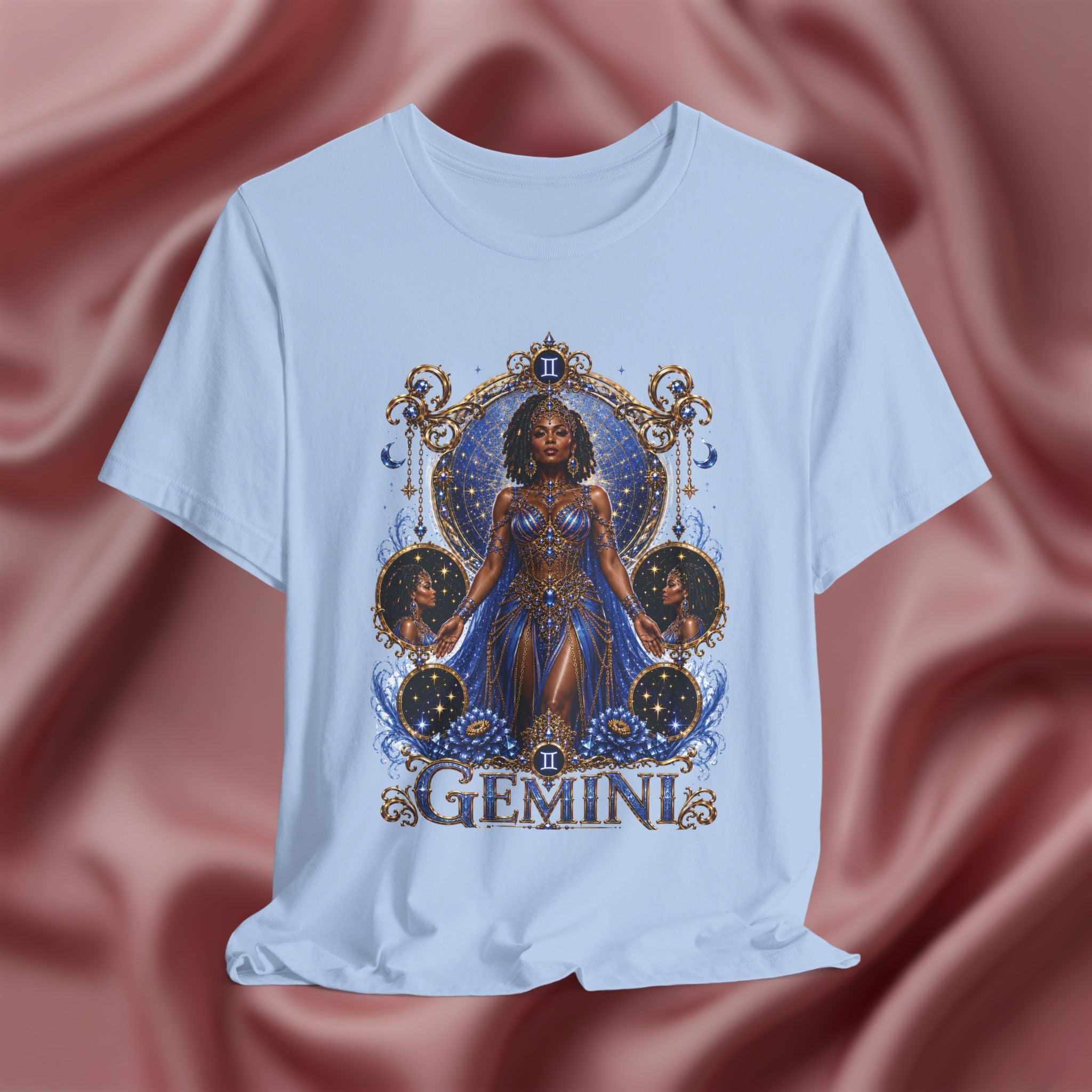 Baby blue t-shirt with 'Gemini' design featuring a woman in a blue dress on a pink fabric background