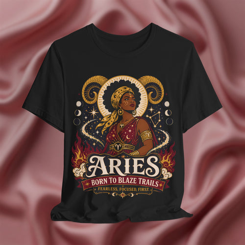 Black t-shirt with Aries zodiac design on a pink fabric background