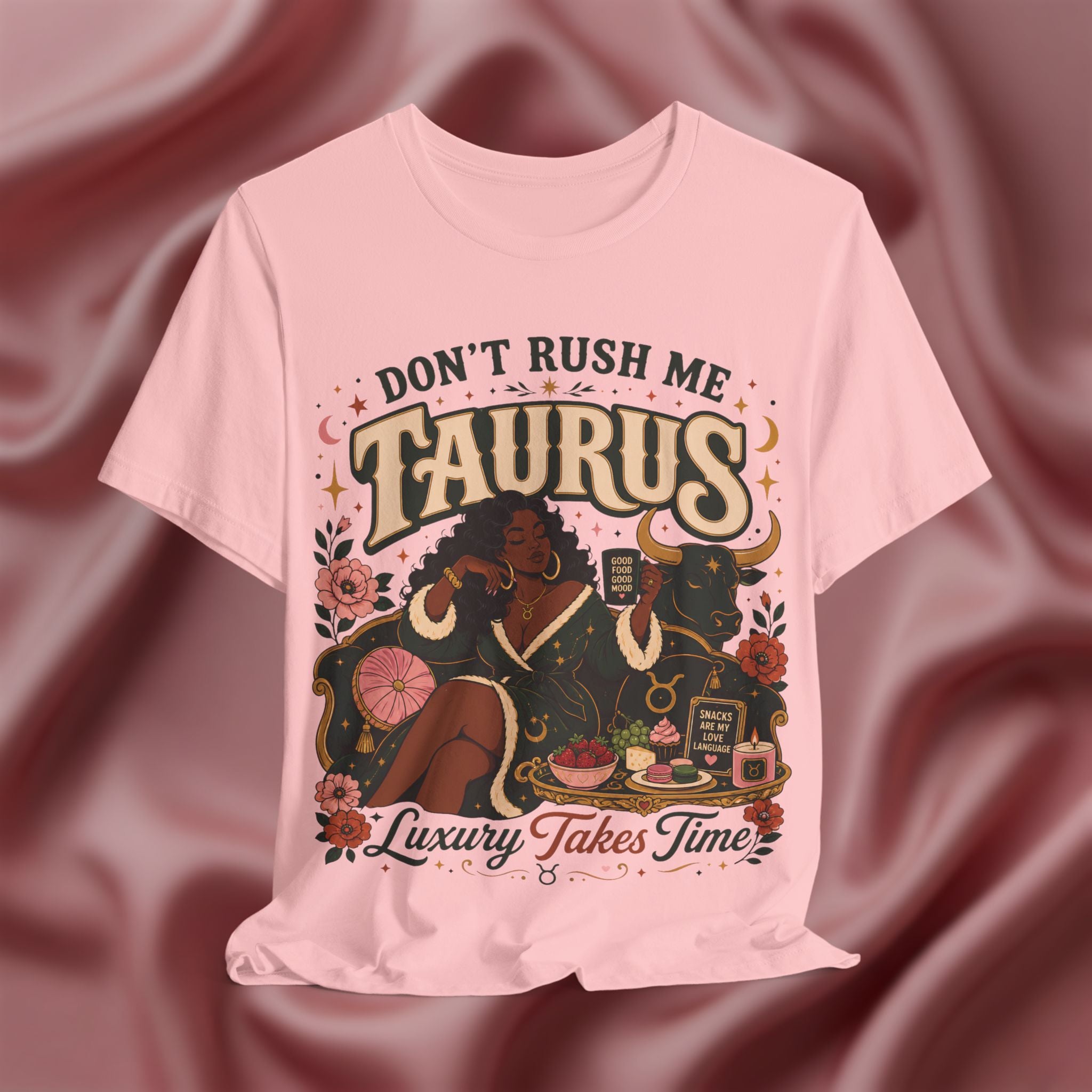 Pink t-shirt with 'Don't Rush Me, Taurus, Luxury Takes Time' design against a pink fabric background