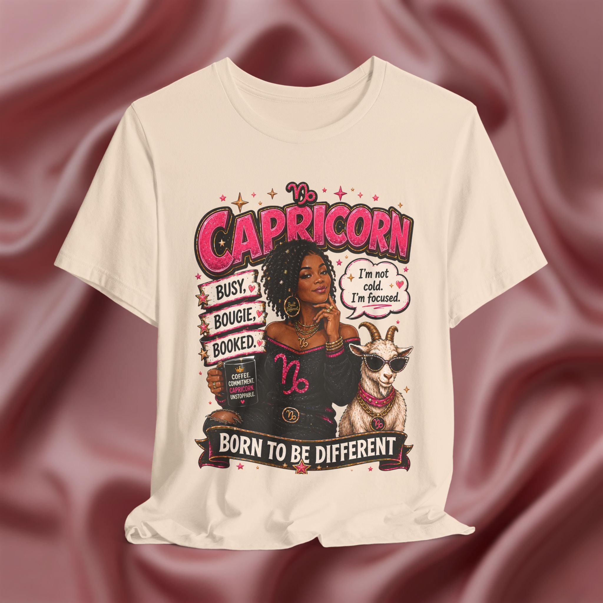 Soft cream t-shirt with Capricorn zodiac design featuring a woman and goat on a maroon fabric background.