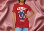 Person wearing a red t-shirt with American flag sunflower and 'AQUARIUS ENERGY' text on a textured pink background