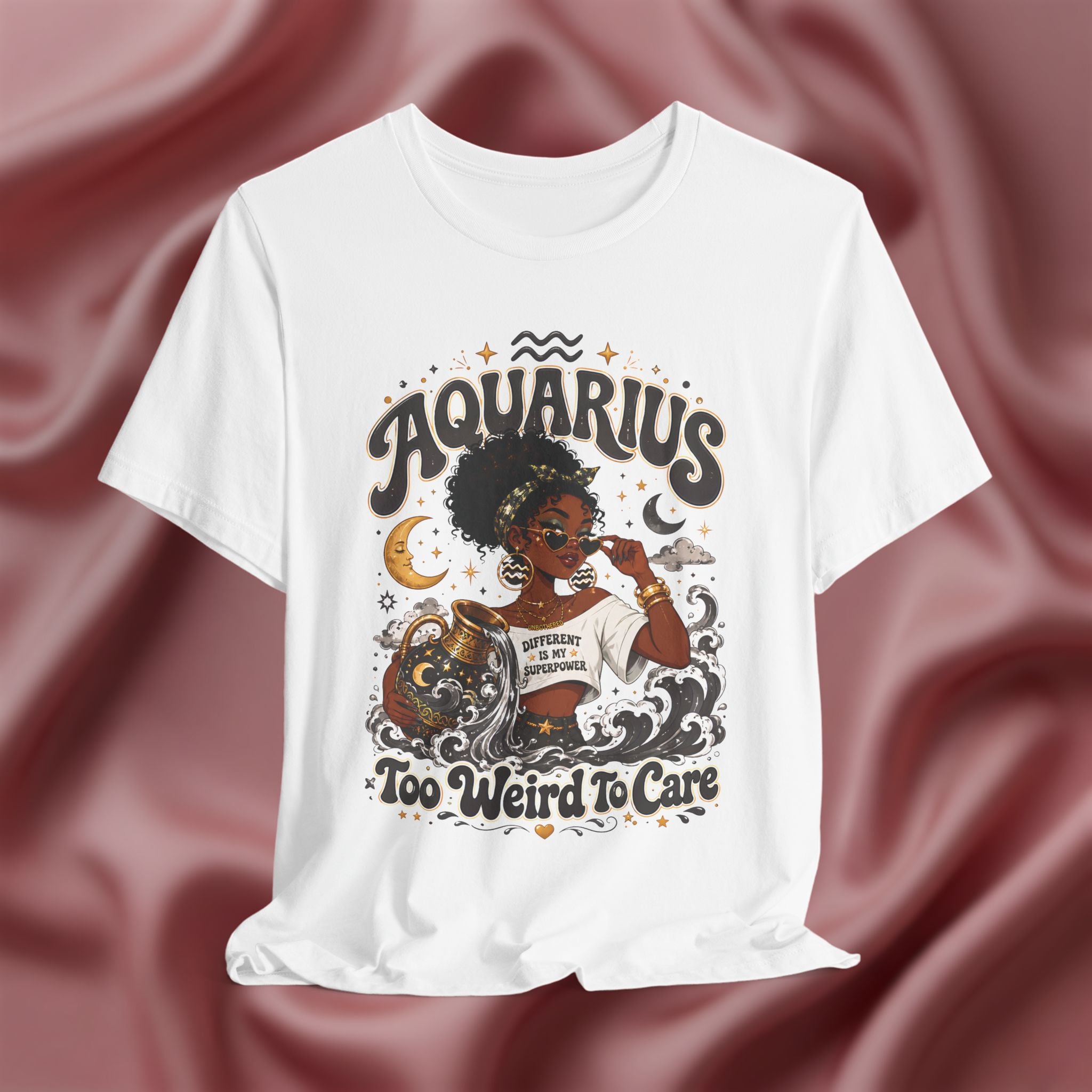 White t-shirt with 'Aquarius Too Weird To Care' design featuring a black woman wearing a t-shirt with the text 'different is my superpower' on a pink fabric background
