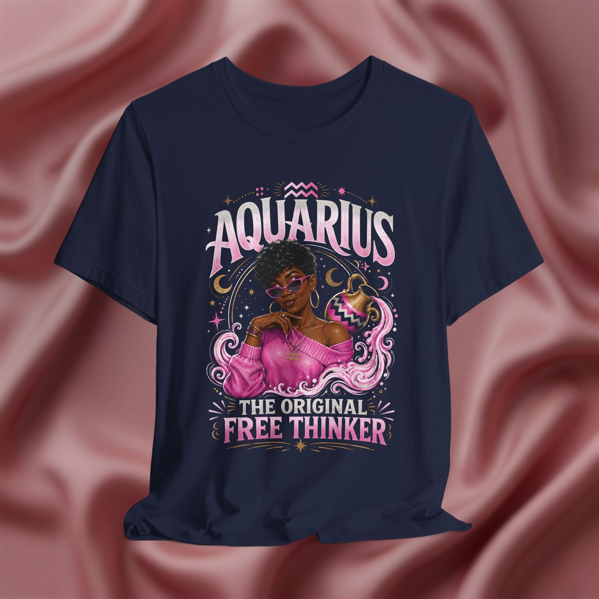 Navy blue t-shirt with Aquarius design featuring a black woman and text 'The original free thinker' on a pink fabric background