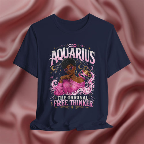 Navy blue t-shirt with Aquarius design featuring a black woman and text 'The original free thinker' on a pink fabric background