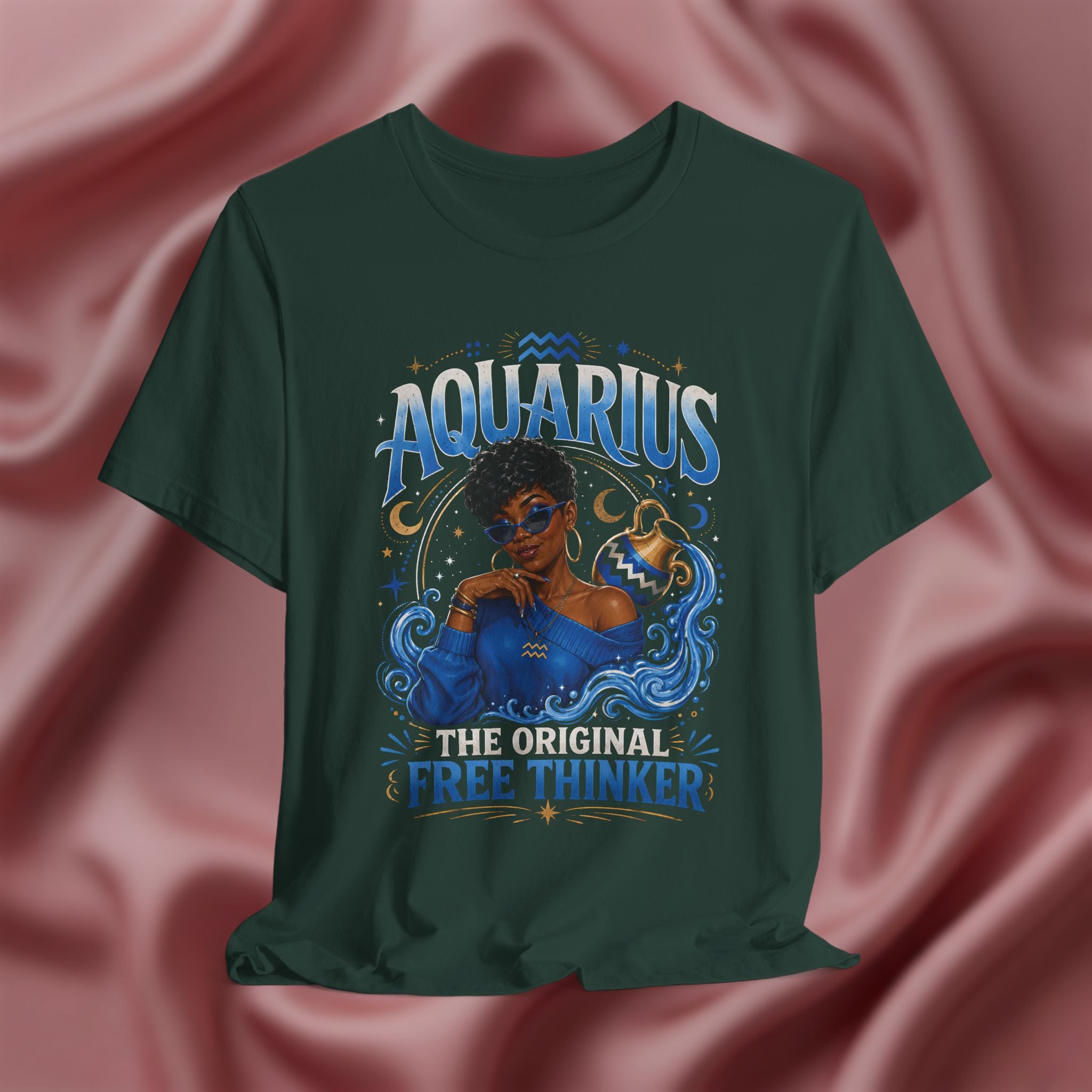 Green t-shirt with Aquarius design featuring a black woman and text 'The original free thinker' on a pink fabric background