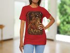 Person wearing a red t-shirt with Aries zodiac design indoors.