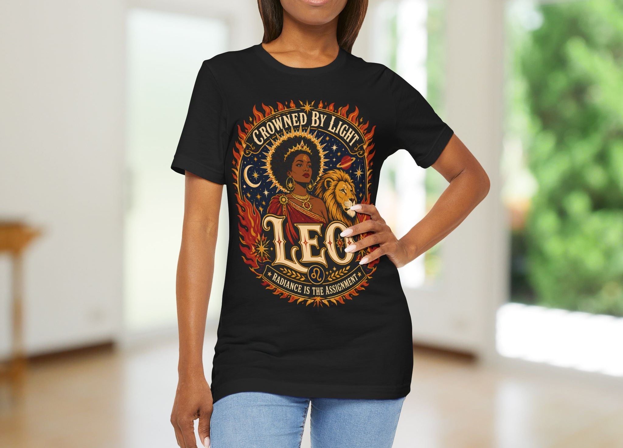 Woman wearing a black t-shirt with 'Crowned by Light Leo' design