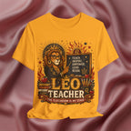Golden Yellow t-shirt with a graphic design of a lion holding a chalkboard and text 'Leo Teacher'