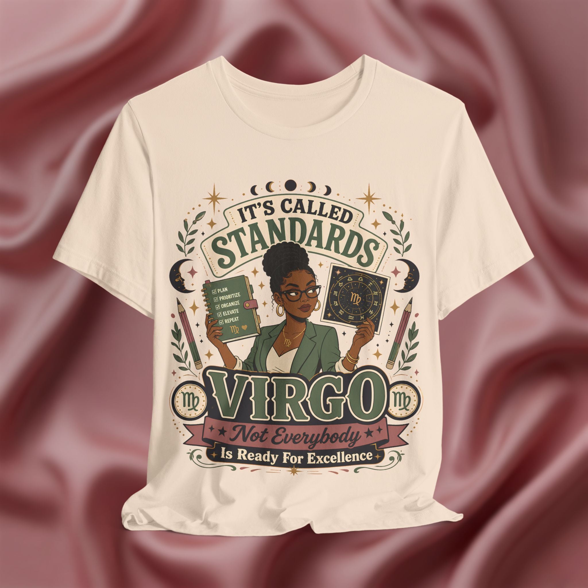 Soft cream t-shirt with Virgo zodiac design on a maroon fabric background