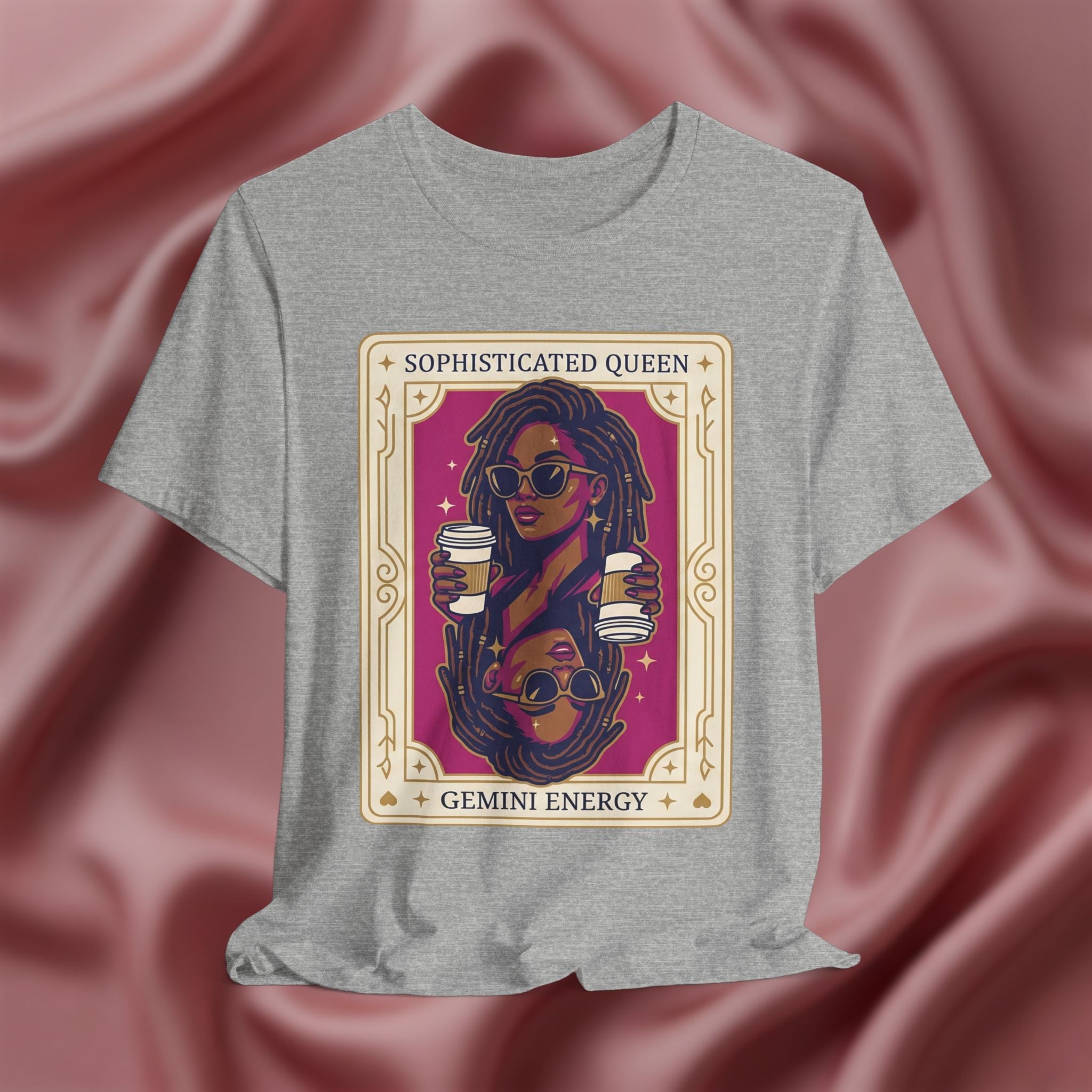 Sophisticated Queen Gemini Energy Gray t-shirt with a graphic design of a woman holding coffee cups on a pink fabric background