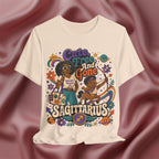 Soft cream T-shirt with Sagittarius zodiac design on a textured brown background